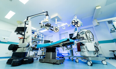 Neurosurgery OR setup. Bright and sterile operating room prepared for neurosurgery with advanced equipment and surgical tools ready for use.