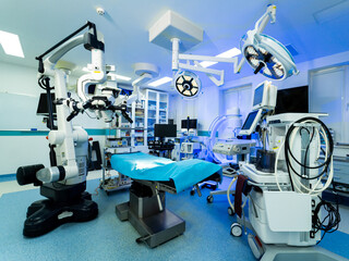 Neurosurgery tech setup. Advanced surgical instruments and equipment are arranged in a neurosurgery operating room ready for procedures.