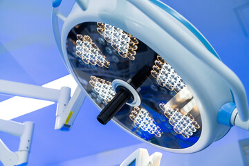 Neurosurgery room lighting. Bright surgical lighting illuminates a neurosurgery operating room,...