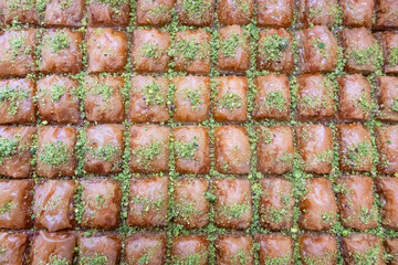 Turkish baklava dessert sprinkled with pistachio crumbs.