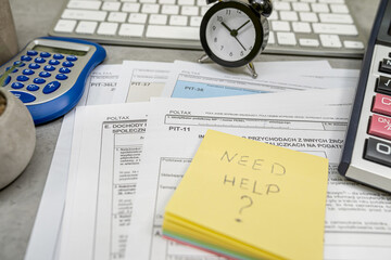 Text Need help on sticker Annual tax polish tax forms PIT-36 PIT-37 PIT-38 with pen calculator.