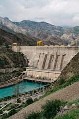Exploring the majesty of the Toktogul Dam in Kyrgyzstan surrounded by stunning mountain landscapes