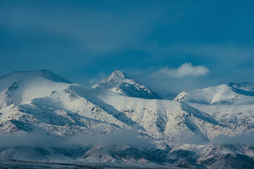 Winter snowy mountain peaks in Kyrgyzstan
