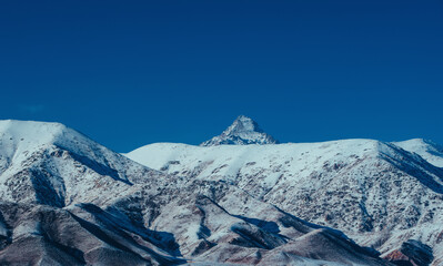 Winter snowy mountain peaks in Kyrgyzstan