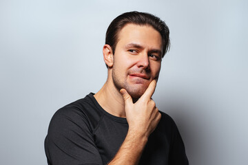 Man uncertain and looking aside portrait on white background