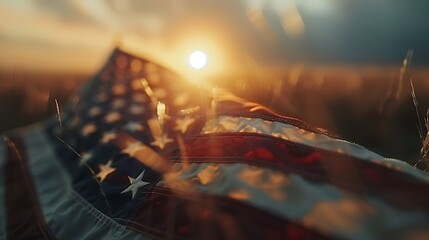 Closeup view of the American flag with sunset scene background. 4th of July concept