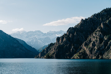 Serenity amidst the majestic mountains of Kyrgyzstan near a tranquil lake