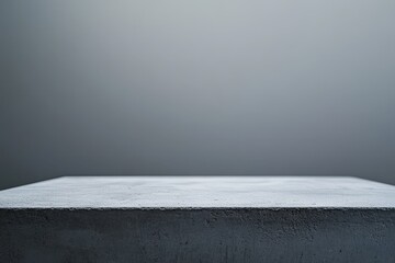 A concrete block countertop against a gradient gray background