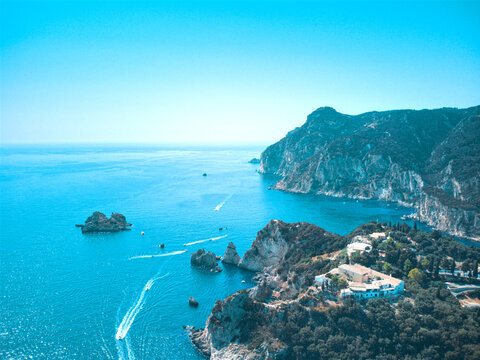 Beautiful drone areal view of Glifada in Corfu, Greece by blue sea