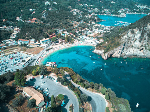 Beautiful drone areal view of Glifada in Corfu, Greece by blue sea