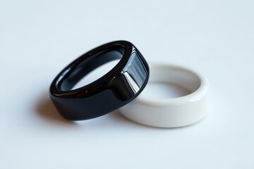 Silver and black signet ring modern smart ring on a light backdrop