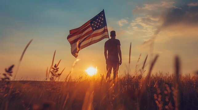 Man holding american USA flag in the sunset. Independence Day or traveling in America concept. - Powered by Adobe