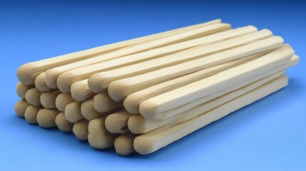 Wooden matches stacked on blue background