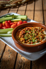 Hummus with roasted chickpeas and crudité platter.