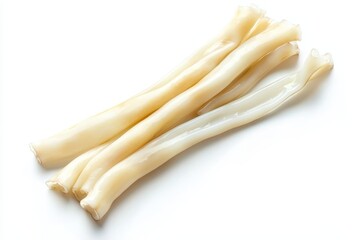 Top view of raw squid or calamari tubes on white