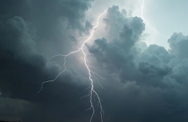 Dramatic stormy sky with lightning strikes during thunderstorm. Cloudscape with dynamic weather, dangerous electric discharges. Atmospheric scenery of natural power, climate change. Dark clouds
