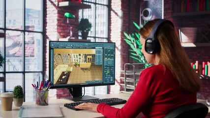 Woman arranging virtual assets in a architectural software on dual monitors, creating a detailed 3D render of a floor plan. Freelancer uses program for computer aided interior design. Camera B.