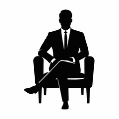 A businessman sitting on a chair working at a desk with a laptop in an office setting