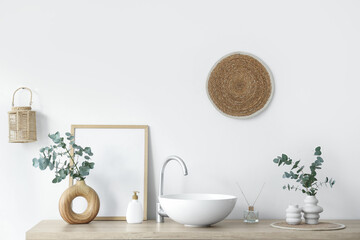 Chest of drawers with sink, photo frame and vases with eucalyptus twigs near white wall in bathroom