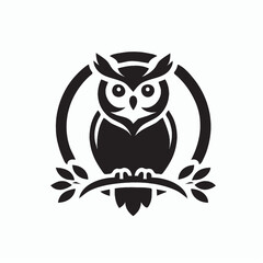 Fototapeta premium A stylized black owl silhouette perched on a branch within a circular frame.