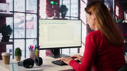 Mature woman interacting with a virtual assistant on her computer at home desktop, AI generated responses and smart automation to improve online communication. Data driven solutions. Camera B.
