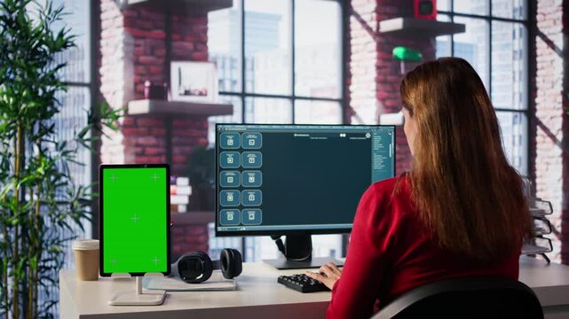 Freelancer interacting with smart AI virtual assistant next to mockup screen, using innovative chatbot web interface. Machine learning enhances productivity through advanced algorithms. Camera B.