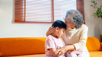 Happy Asian family grandmother and grandchild enjoy and fun relaxing and playing together at home....