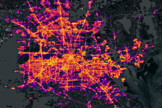 Heatmap of city with glowing orange and purple lights showing urban activity. Illuminating population density and traffic flow. Houston at night. Elements of this image furnished by NASA