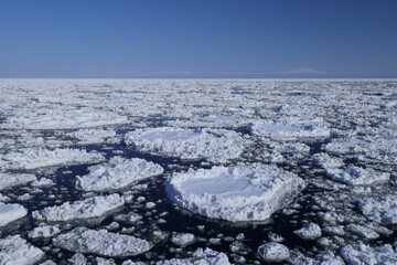 Shiretoko, ice floe with Shiretoko mountain chain in Hokkaido, Japan © shuttered