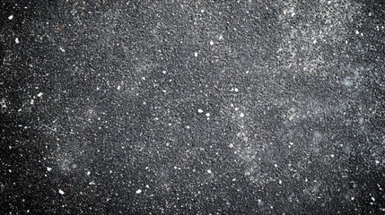 A close up photograph of a textured dark surface
