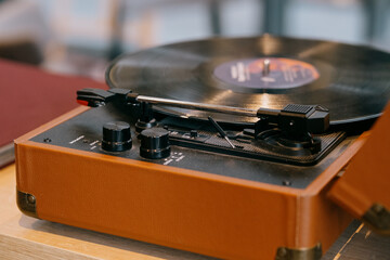 Vintage turntable spinning a vinyl record Warm hues and classic design evoke nostalgia for analog...