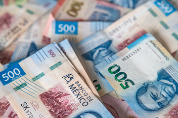 Close-up macro detail of 500 Mexican peso banknotes