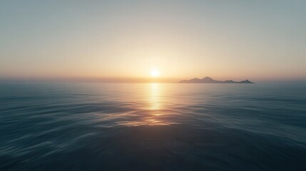 Serene ocean scene showing the sunrise over distant mountains and water