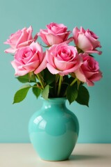 Fototapeta premium Full bloom pink roses in a glossy turquoise ceramic vase , glossy, arrangement