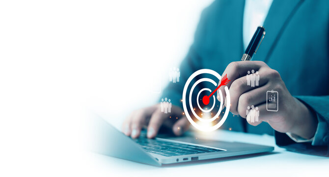 Businessman hold virtual target icons for business objective. Strategic planning for business growth and target customer group. set up business objective target goal.value, growth,	
