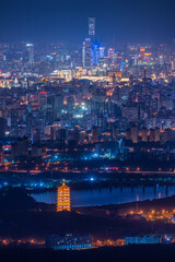 Overlooking the night view of Beijing Garden Expo Park Yongding Tower and China World Trade Center CBD