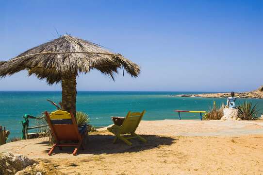Beach umbrella and chairs overlooking tropical ocean in Macanao Margarita Island