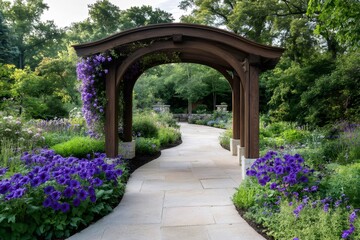 Wooden pergola inviting to walk in a colorful garden path