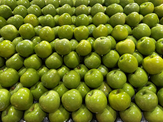 fresh green apples in the market, full frame healthy food background