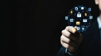 Digital interface with security icons held by a professional in a dark setting.