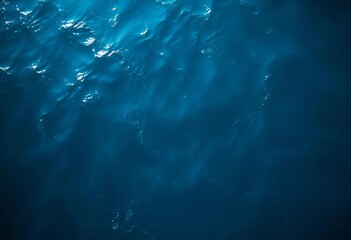 Dark, swirling blue ocean surface above, sunlight filtering down,  submarine, oceanography