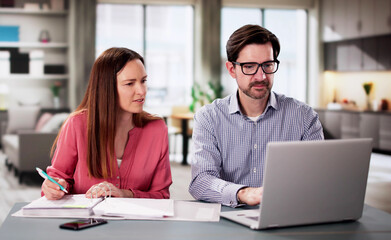 Happy couple doing retire finances plan