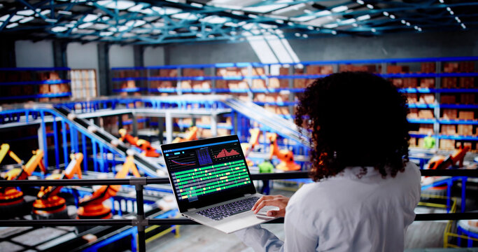 Engineer Worker Using Warehouse Automation Dashboard