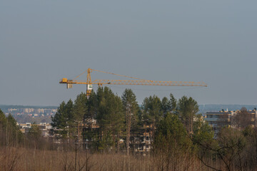 a large crane working on a new block