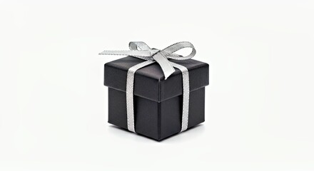 Obraz premium A Small Black Gift Box With a Silver Ribbon Tied Around It