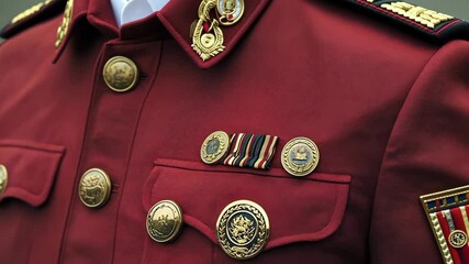 Military uniform with medals and insignias displayed at a formal event in a city setting - Powered by Adobe