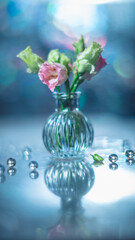 Beautiful pink and green flowers in a vase on a table