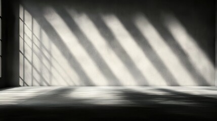 A room with a white wall and a window.