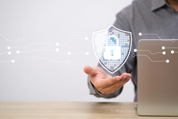 Secure digital protection concept with a man holding shield icon; illustrating modern online...