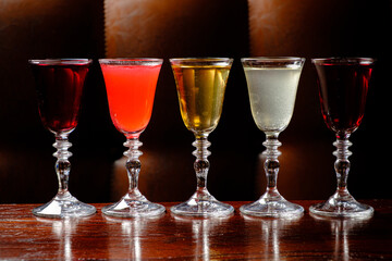 Five beautifully designed glasses, each with a unique drink, spark curiosity and temptation